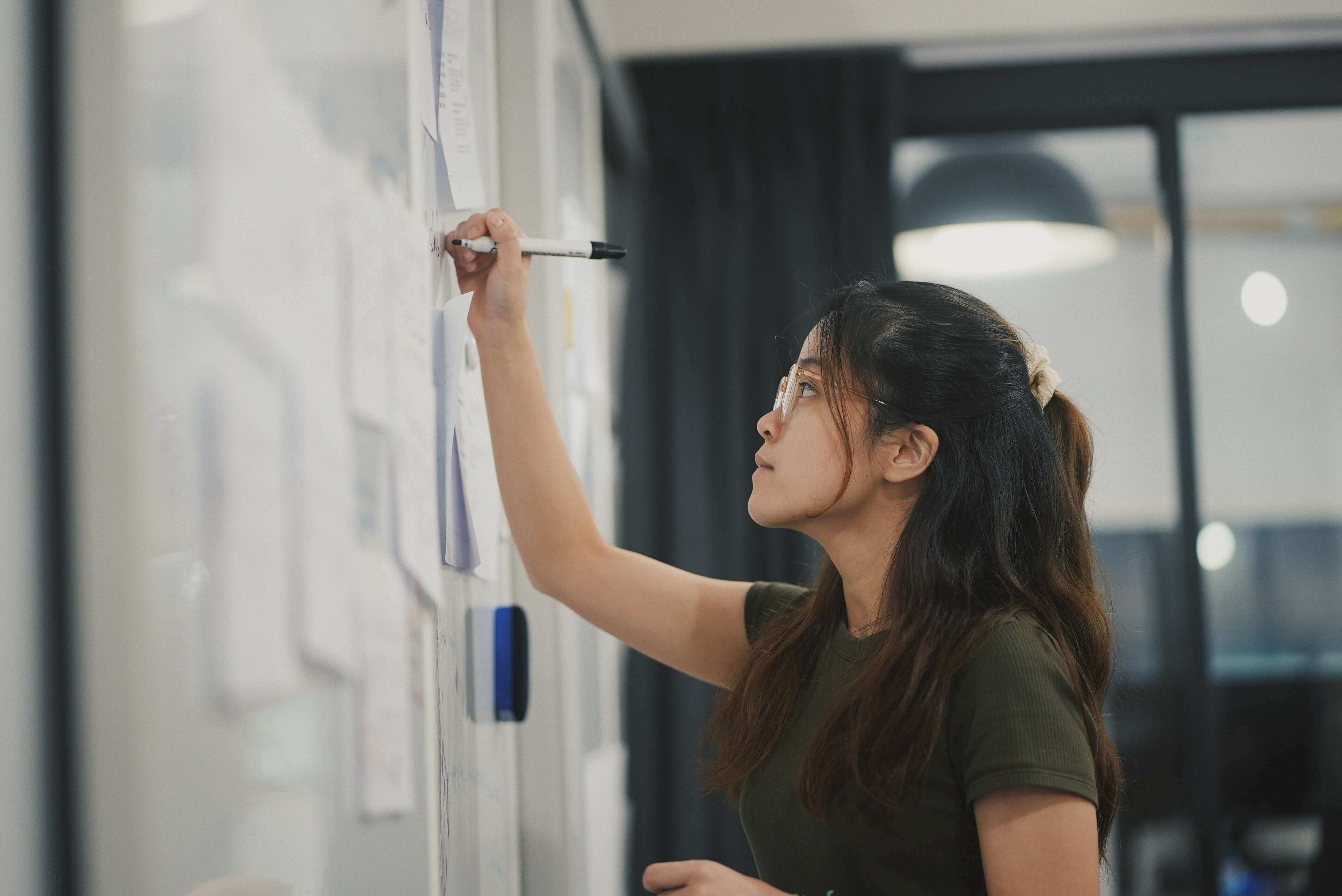 Designer working on a whiteboard