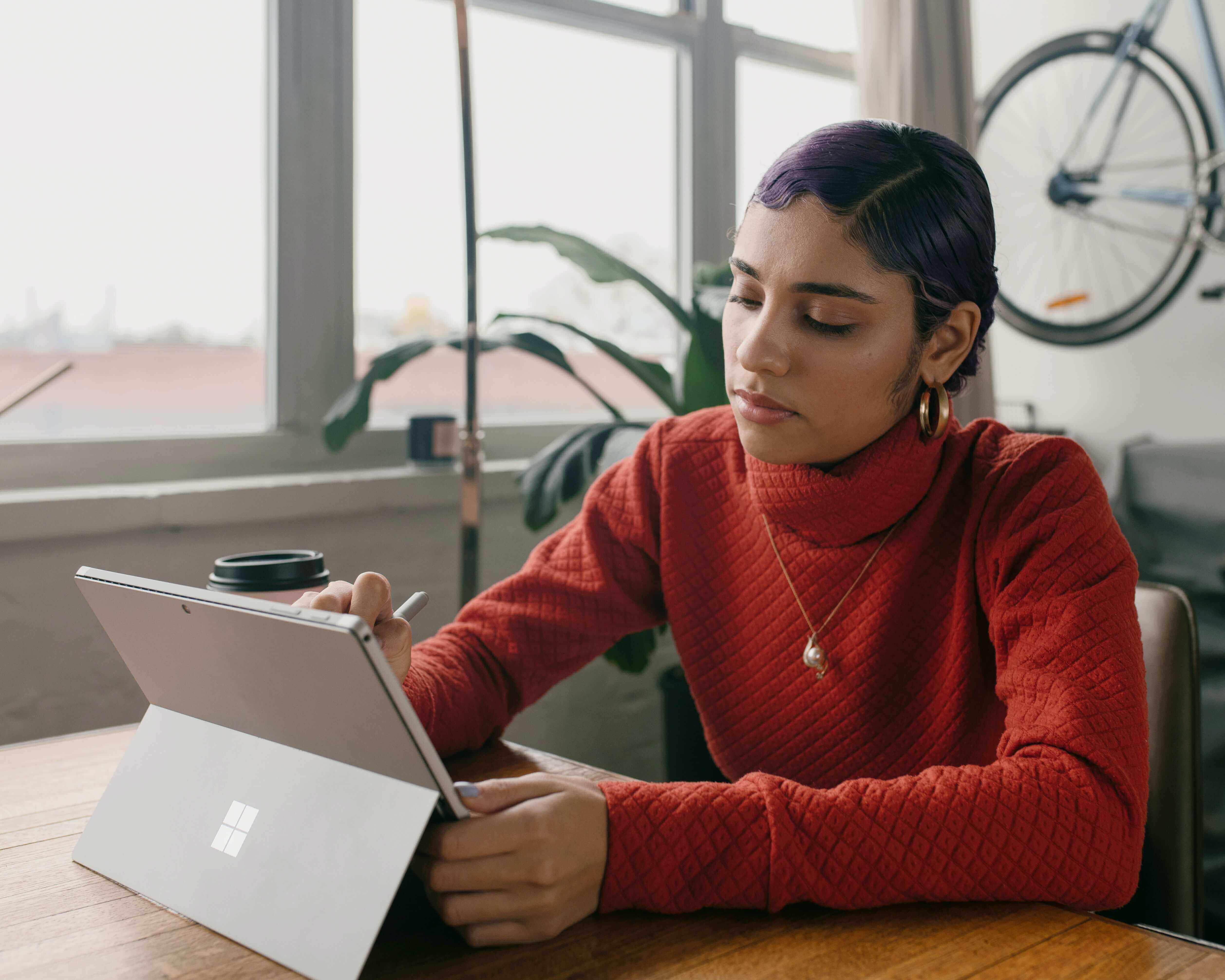 Designer working on a Microsoft surface