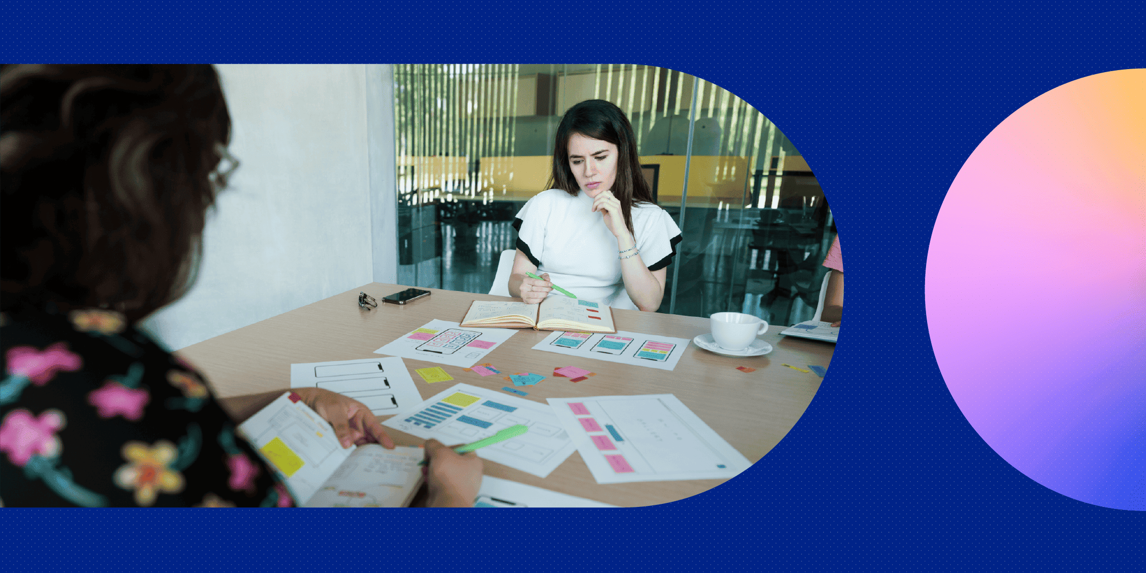 Two employees in a boardroom working on UX writing and content design.