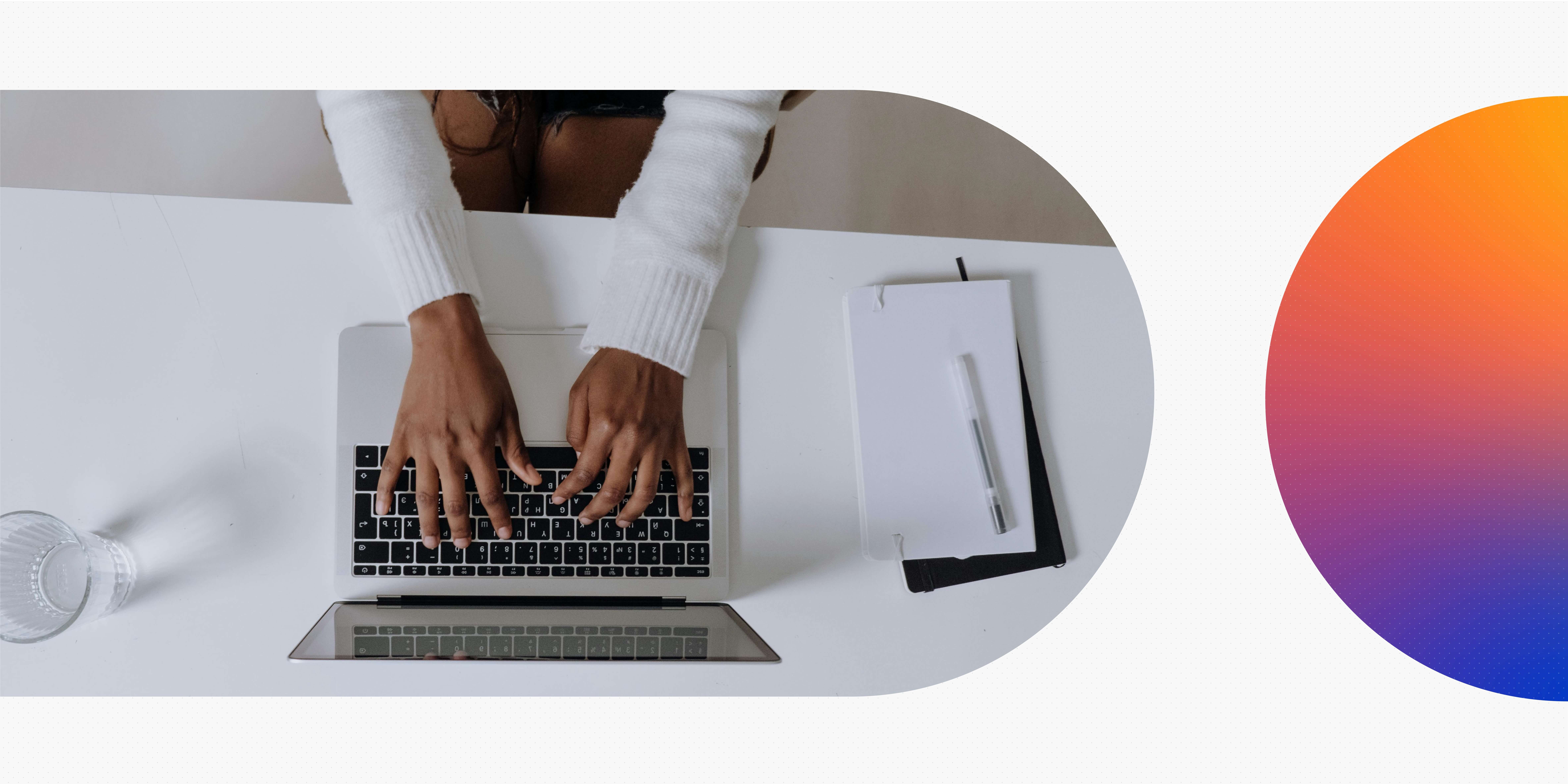Hands on a laptop keyboard.