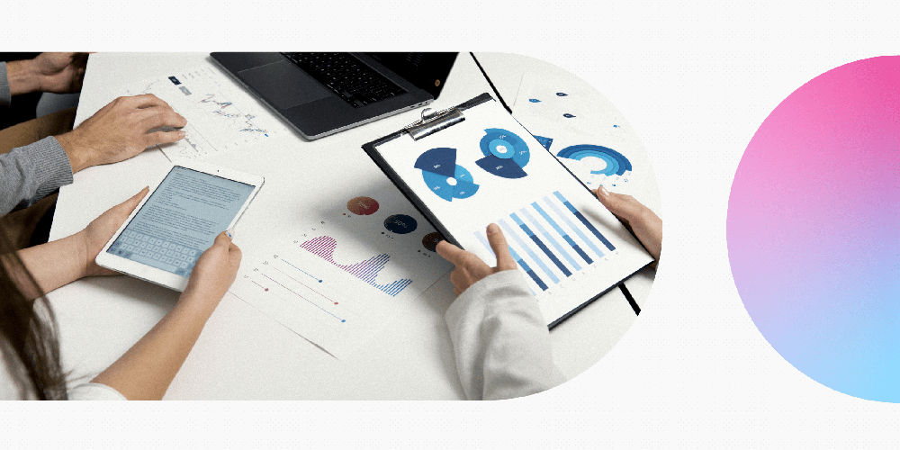 Laptop, tablet and papers with different outlines for designs.