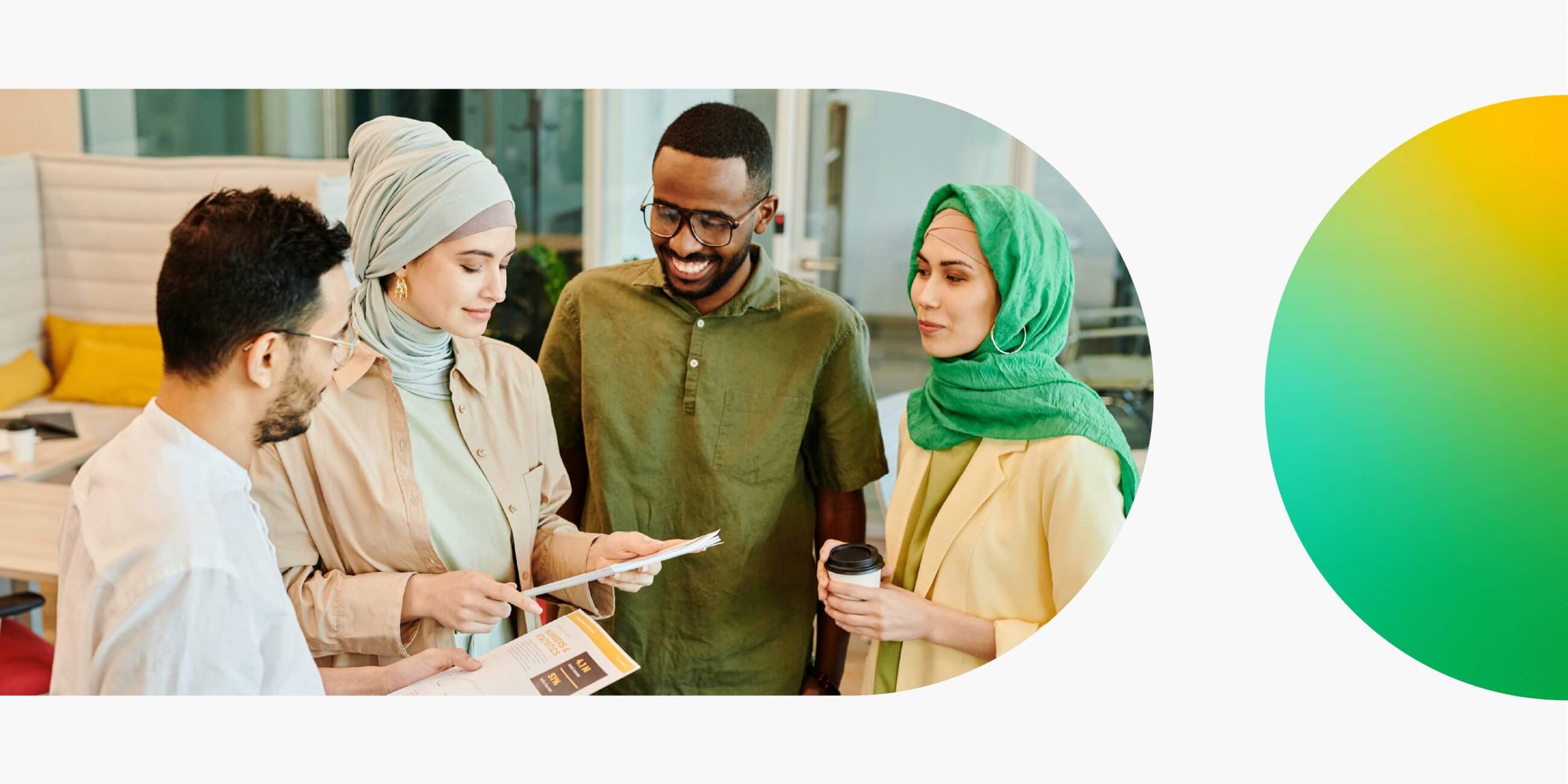 Group of people standing together, holding and discussing a printed UX research report.