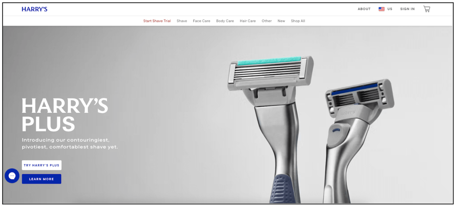 Harry’s website banner promoting Harry’s Plus. Large bold text on the left introduces the product as the brand’s most contouring, pivoting, and comfortable shave yet. On the right, two silver razors with coloured blades are displayed against a clean grey background, with buttons below to try or learn more.